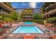 An inviting pool and jacuzzi area surrounded by lounge chairs and lush landscaping, perfect for relaxation at 7167 E Rancho Vista Dr # 4011, Scottsdale, AZ 85251