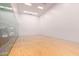 Clean racquetball court with finished wood floor and glass-walled viewing area at 7167 E Rancho Vista Dr # 4011, Scottsdale, AZ 85251