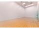 Clean racquetball court with finished wood floor and simple design at 7167 E Rancho Vista Dr # 4011, Scottsdale, AZ 85251