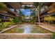 A beautiful water feature set in a courtyard framed by lush landscaping and modern architecture at 7167 E Rancho Vista Dr # 4011, Scottsdale, AZ 85251