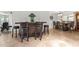 Home bar featuring a bar with stools, tile floors, and a dining area with a full-sized table at 7611 E Pasadena Ave, Scottsdale, AZ 85250