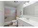 Clean bathroom featuring modern vanity, enclosed glass shower, and neutral color scheme at 7611 E Pasadena Ave, Scottsdale, AZ 85250