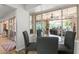 Bright breakfast nook featuring a glass table and backyard views at 7611 E Pasadena Ave, Scottsdale, AZ 85250