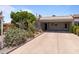 Charming single-story home with a carport, mature landscaping, and well-maintained facade at 7611 E Pasadena Ave, Scottsdale, AZ 85250
