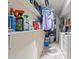 Functional laundry room with shelving, washer, and dryer at 7611 E Pasadena Ave, Scottsdale, AZ 85250