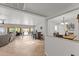 Open-concept living space with tile floors, a bar area, and backyard access at 7611 E Pasadena Ave, Scottsdale, AZ 85250