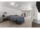 Spacious main bedroom featuring a king bed, carpet, and access to the backyard at 7611 E Pasadena Ave, Scottsdale, AZ 85250