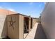 Outdoor storage shed with ample space for tools and equipment, perfect for maintaining a tidy backyard at 7611 E Pasadena Ave, Scottsdale, AZ 85250