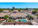 A home with an inviting backyard oasis, complete with a pool, covered patio, RV parking, and mountain views at 7648 W Mauna Loa Ln, Peoria, AZ 85381
