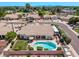 A home with a private backyard featuring a pool, covered patio, well-manicured lawn, and RV parking at 7648 W Mauna Loa Ln, Peoria, AZ 85381
