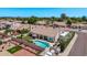 Aerial view of a well-maintained home with a pool, covered patio, landscaped yard, and RV parking at 7648 W Mauna Loa Ln, Peoria, AZ 85381