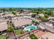 A home with a backyard oasis featuring a pool, covered patio, lush landscaping, and RV parking in a residential neighborhood at 7648 W Mauna Loa Ln, Peoria, AZ 85381