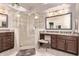 Updated bathroom with a glass-enclosed shower, vanity, and updated fixtures at 7648 W Mauna Loa Ln, Peoria, AZ 85381