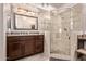 Contemporary bathroom with a glass-enclosed shower, vanity, and updated fixtures at 7648 W Mauna Loa Ln, Peoria, AZ 85381