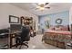 Bedroom features two-tone walls and large desk area at 7648 W Mauna Loa Ln, Peoria, AZ 85381