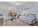 Bright bedroom with large window and fitness bike at 7648 W Mauna Loa Ln, Peoria, AZ 85381
