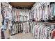 Walk-in closet with an abundance of hanging storage at 7648 W Mauna Loa Ln, Peoria, AZ 85381