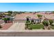 Beautiful home with a three-car garage, manicured lawn, and well-kept landscaping at 7648 W Mauna Loa Ln, Peoria, AZ 85381