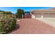Home with RV parking behind a closed wooden gate and a three-car garage at 7648 W Mauna Loa Ln, Peoria, AZ 85381