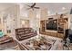 Open living room with high ceilings, neutral tones, and stylish decor and fireplace at 7648 W Mauna Loa Ln, Peoria, AZ 85381