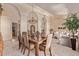 Elegant dining area with an open-concept view to the living room, enhancing the home's flow at 7648 W Mauna Loa Ln, Peoria, AZ 85381