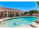 A serene swimming pool area with lounge chairs, perfect for relaxation and outdoor entertaining at 7648 W Mauna Loa Ln, Peoria, AZ 85381