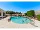 Well-maintained backyard featuring a sparkling pool, mature landscaping, and a serene outdoor setting at 7648 W Mauna Loa Ln, Peoria, AZ 85381
