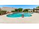 Relaxing backyard pool with lush landscaping, mature trees, and ample privacy at 7648 W Mauna Loa Ln, Peoria, AZ 85381