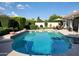 Inviting backyard pool with lush landscaping and a patio area perfect for entertaining at 7648 W Mauna Loa Ln, Peoria, AZ 85381