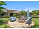 Backyard patio featuring a fire pit and outdoor seating, ideal for entertaining and enjoying the outdoors at 8329 N Ridgeview Dr, Paradise Valley, AZ 85253