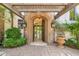 Grand entrance featuring a stone archway leading to bright interior with views of outdoor scenery at 8329 N Ridgeview Dr, Paradise Valley, AZ 85253