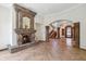 Stunning foyer with herringbone wood floors, stone columns, arched entryways, and a glimpse of an ornate staircase at 8329 N Ridgeview Dr, Paradise Valley, AZ 85253
