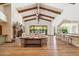 Bright living room with exposed wooden beams, hardwood floors, and a fireplace at 8329 N Ridgeview Dr, Paradise Valley, AZ 85253