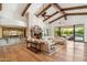Spacious living room featuring a fireplace, wood beam ceilings, and an open floor plan at 8329 N Ridgeview Dr, Paradise Valley, AZ 85253