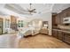 Spacious main bedroom with a fireplace, chandelier, seating area, and wood floors at 8329 N Ridgeview Dr, Paradise Valley, AZ 85253