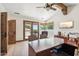 Spacious office with wood floors, ceiling fan, desk, and balcony at 8329 N Ridgeview Dr, Paradise Valley, AZ 85253