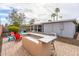 Outdoor kitchen with brick patio and colorful Adirondack chairs offer inviting entertainment space at 836 W Mitchell Dr, Phoenix, AZ 85013