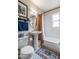 Charming bathroom with pedestal sink, patterned floor tiles, and subway tile shower at 836 W Mitchell Dr, Phoenix, AZ 85013