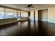 Bright bedroom with dark wood flooring and glass door leading to the outdoor patio at 836 W Mitchell Dr, Phoenix, AZ 85013