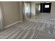 Bedroom with plush carpet, large windows, and mirrored closet doors at 836 W Mitchell Dr, Phoenix, AZ 85013