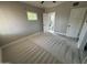 Bedroom featuring neutral walls and plush carpeting, leading to an adjoining bathroom at 836 W Mitchell Dr, Phoenix, AZ 85013