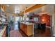 Open-concept kitchen with modern appliances, island seating, and easy access to the living area at 836 W Mitchell Dr, Phoenix, AZ 85013