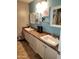 Bathroom with white cabinetry, and sinks, and a countertop with ample space at 9252 W Carol Ave, Peoria, AZ 85345