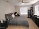 This spacious bedroom features a ceiling fan and neutral colors at 9252 W Carol Ave, Peoria, AZ 85345