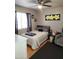 This bedroom has a ceiling fan, large window, and plenty of space for relaxation at 9252 W Carol Ave, Peoria, AZ 85345