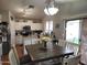 Open kitchen and dining area with a view to the backyard sliding doors and stainless steel appliances at 9252 W Carol Ave, Peoria, AZ 85345