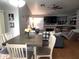 Spacious dining and living room with vaulted ceilings, a cozy fireplace, and plenty of natural light at 9252 W Carol Ave, Peoria, AZ 85345