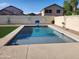 Backyard pool offering a refreshing oasis with surrounding hardscape and privacy at 9252 W Carol Ave, Peoria, AZ 85345