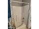 Well-lit shower has a detachable showerhead and built-in seat at 9252 W Carol Ave, Peoria, AZ 85345