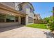Spacious backyard with paver patio, artificial grass, and bistro lighting at 1081 E Armstrong Way, Chandler, AZ 85286